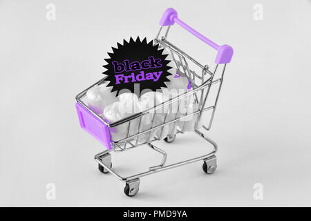 Black Friday sticker in a shopping cart on white background Stock Photo