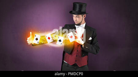 Illusionist in tails bandy play cards between his two hands Stock Photo ...