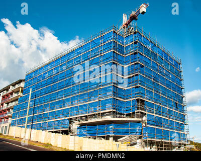 Gosford, New South Wales, Australia - September 7. 2018: Construction and building progress update 135.  A working tower crane on new home units build Stock Photo