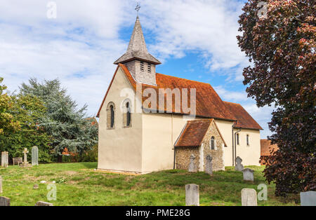 Surrey heritage: small, historic Wisley Church and churchyard in the village of Wisley, Surrey, UK which dates back to Norman times in about 1150 Stock Photo