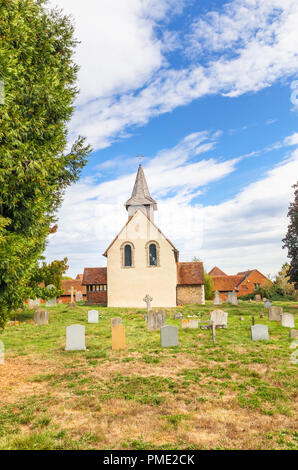 Surrey heritage: small, historic Wisley Church and churchyard in the village of Wisley, Surrey, UK which dates back to Norman times in about 1150 Stock Photo