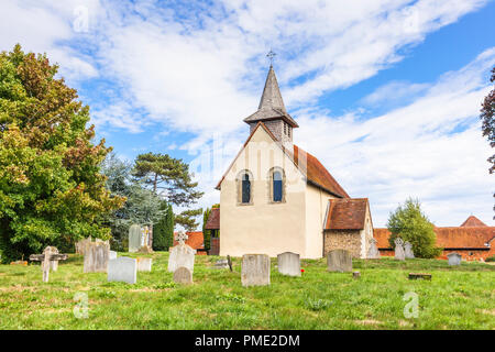 Surrey heritage: small, historic Wisley Church and churchyard in the village of Wisley, Surrey, UK which dates back to Norman times in about 1150 Stock Photo