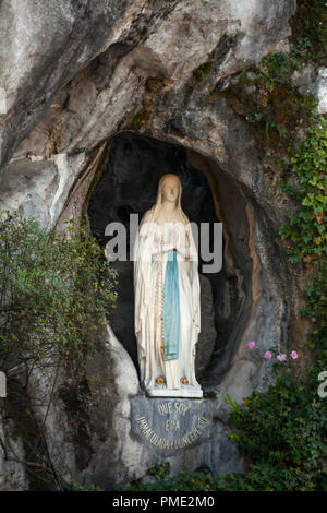 Lourdes (south-western France): statue of the Virgin Mary in the grotto of Massabielle, Our Lady of Lourdes sanctuary (not available for postcard edit Stock Photo