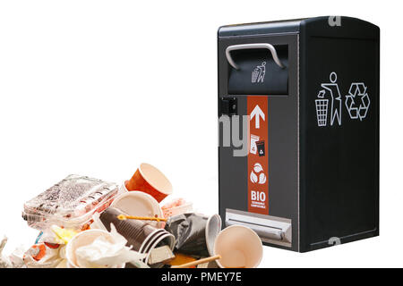 Garbage next to a modern garbage can. The concept is protected by nature and the environment. Stock Photo