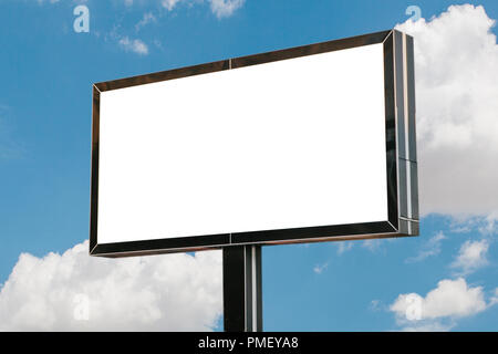 An empty billboard for advertising against the blue sky. Stock Photo