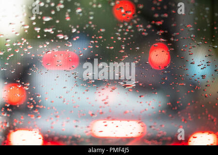 view from the inside onto raindrops on the windshield of the car Stock Photo