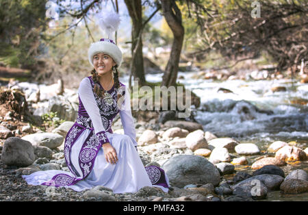 Lake Issyk-Kul, Kurgyzstan, 6th September 2018: young kyrgyz ladies in a nature Stock Photo