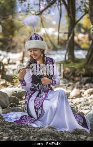 Lake Issyk-Kul, Kurgyzstan, 6th September 2018: young kyrgyz ladies in a nature Stock Photo