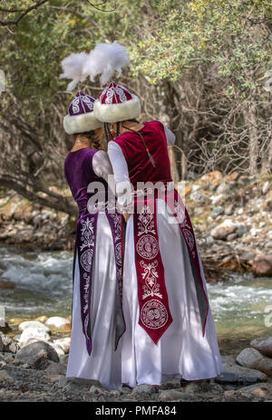 Lake Issyk-Kul, Kurgyzstan, 6th September 2018: young kyrgyz ladies in a nature Stock Photo