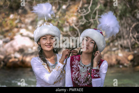 Lake Issyk-Kul, Kurgyzstan, 6th September 2018: young kyrgyz ladies in a nature Stock Photo