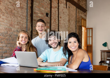 Portrait of group of young caucasian students indoor at trendy office Stock Photo