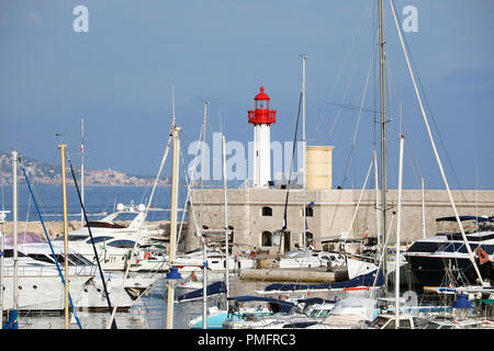 Menton, France - September 16, 2018: Beautiful Panoramic View Of Port Garavan In Menton On The French Riviera, Red And White Lighthouse With Many Yach Stock Photo