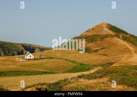 The historic Chapel The Church of the Holy Cross,  Eglwys y Grog ;Welsh: at  Mwnt,  in south Ceredigion, Wales, UK. Stock Photo