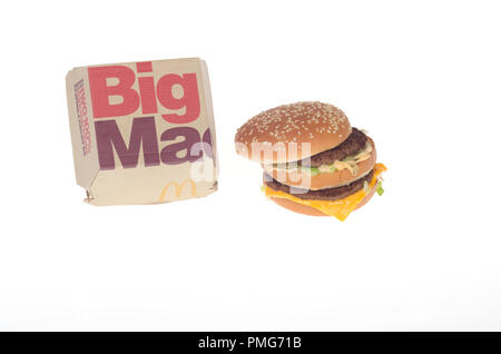 McDonald’s Big Mac burger with 2 beef patties, special sauce, lettuce and cheese on a sesame seed bun with the takeout box container Stock Photo