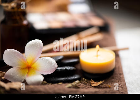 spa setting wirh make up on towel Stock Photo