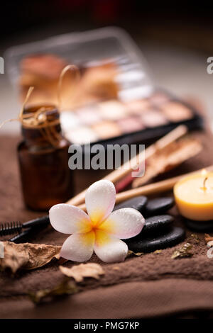 spa setting wirh make up on towel Stock Photo