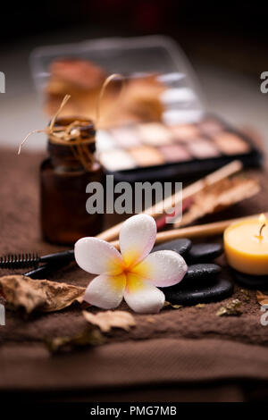 spa setting wirh make up on towel Stock Photo