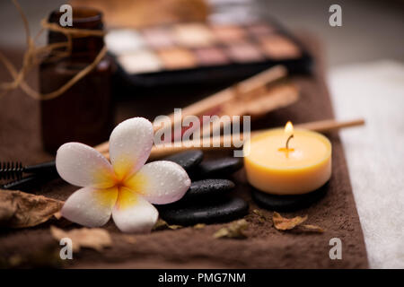 spa setting wirh make up on towel Stock Photo