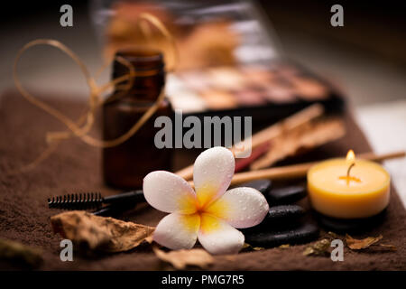 spa setting wirh make up on towel Stock Photo