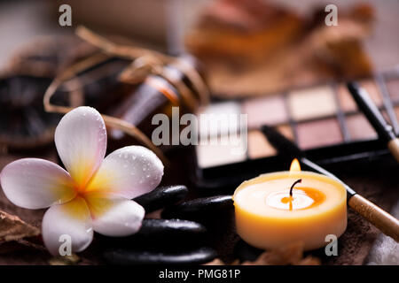 spa setting wirh make up on towel Stock Photo