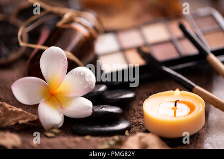 spa setting wirh make up on towel Stock Photo