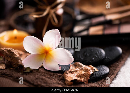 spa setting wirh make up on towel Stock Photo