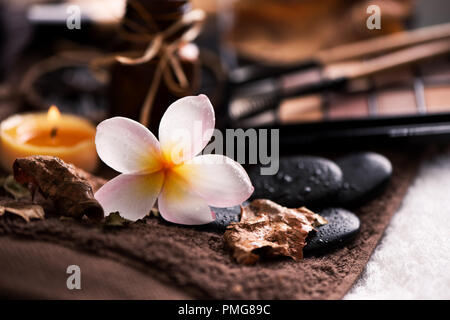 spa setting wirh make up on towel Stock Photo