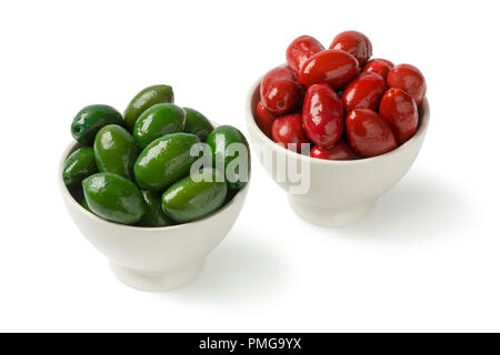 Bowls with red and green Italian Bella olives isolated on white background Stock Photo