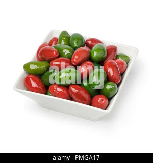 Bowl with red and green Italian Bella olives isolated on white background Stock Photo