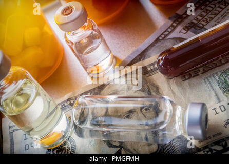 vials with different substances over dollar, concept of copayment Stock Photo