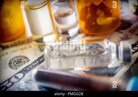 vials with different substances over dollar, concept of copayment Stock Photo