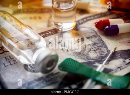 vials with different substances over dollar, concept of copayment Stock Photo