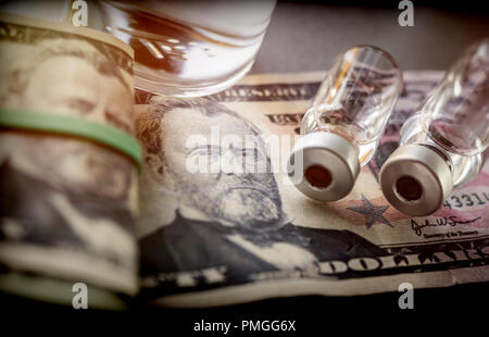 vials with different substances over dollar, concept of copayment Stock Photo