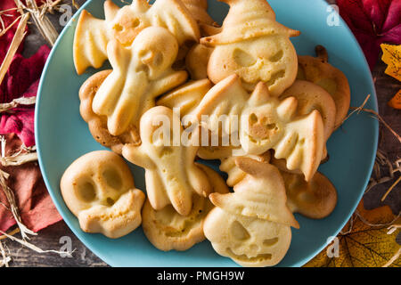 Homemade Halloween cookies on wooden table. Stock Photo