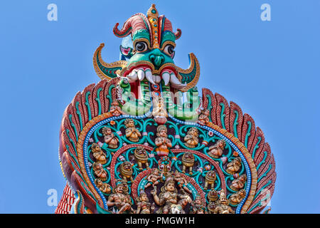 MEENAKSHI TEMPLE MADURAI TAMIL NADU INDIA  CLOSE UP OF DEMON ON THE TOP OF A TOWER WITH MANY TEETH OR FANGS Stock Photo