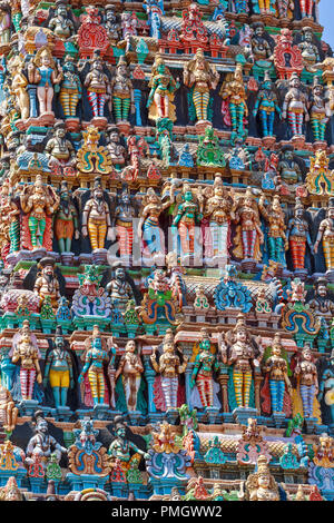MEENAKSHI TEMPLE MADURAI TAMIL NADU INDIA  TEMPLE TOWER DETAIL MANY STATUES OF DEMONS AND GODS Stock Photo