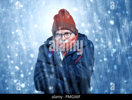 Handsome young boy shivering and trembling at snowstorm concept  Stock Photo