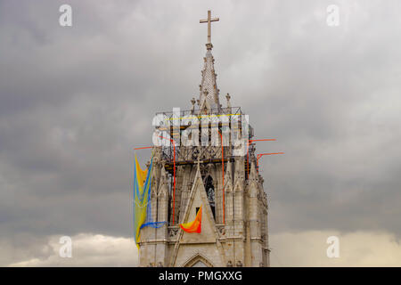 QUITO, ECUADOR - AUGUST 24, 2018: View of the towers of the Basilica in Quito, Ecuador with the city visible in the background Stock Photo