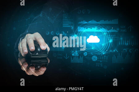 Hand using wireless mouse with cloud technology concept and dark background Stock Photo