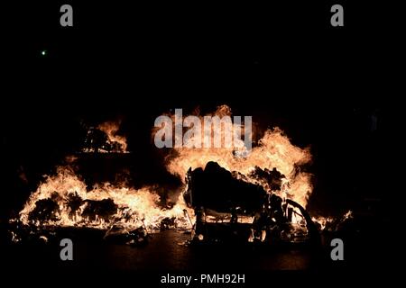 Athens, Greece. 18th Sep, 2018. Trash cans in seen burning during the clashes.Protest and clashes against the murder and marking the fifth anniversary of Pavlos Fyassas, who was short by neo-Nazi in the port city of Piraeus. Credit: Giorgos Zachos/SOPA Images/ZUMA Wire/Alamy Live News Stock Photo