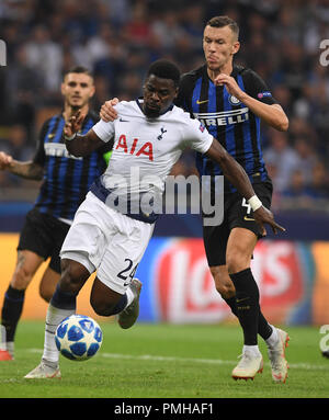 Milan, Italy. 18th Sep, 2018. Inter Milan's Ivan Perisic (1st R) vies with Tottenham's Serge Aurier (C) during a UEFA Champions League group B match between FC Inter and Tottenham Hotspur, in Milan, Italy, Sept. 18, 2018. FC Inter won 2-1. Credit: Alberto Lingria/Xinhua/Alamy Live News Stock Photo