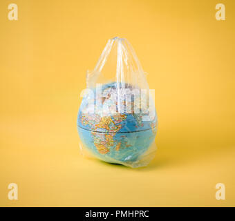 globe model in plastic bag, save the world environment Stock Photo