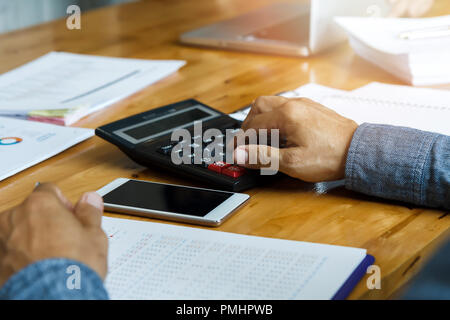 Businessman using calculator to calculate budget, Business concept Stock Photo