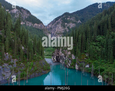 Kaindy Lake in Kazakhstan Known Also as Birch Tree Lake or Underwater Forest. Is a 400 Meter Long Lake That Reaches Depths Near 30 Meters in Some Area Stock Photo