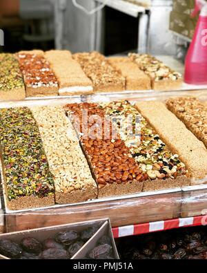 Halva confectionery with nuts in a street market, Israel Stock Photo