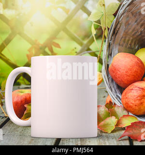 Falling Mug Empty White coffee mug mockup with apples, pumpkins and fall leaves. Empty ...