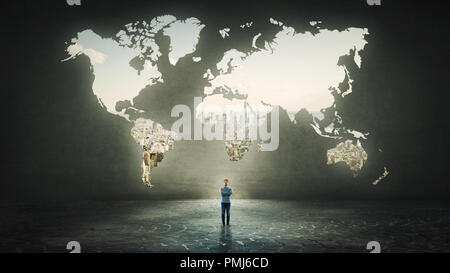 Confident businessman with crossed hands standing alone in front of the world map hole as a window shaped in a concrete wall with a view to the city. Stock Photo