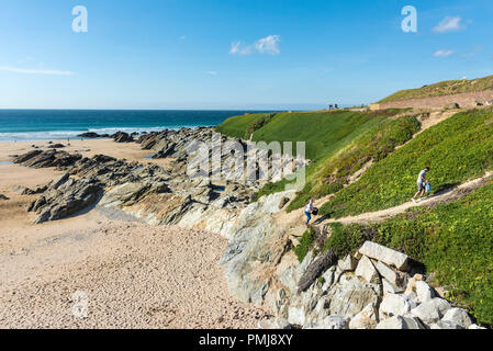 Rocks at North Fistral exposed at low tide in Newquay in Cornwall. Stock Photo