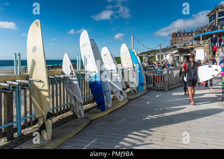 Surfboards available for hire at Fistral Beach in Newquay in Cornwall. Stock Photo