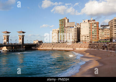 View of the city beach and the towers of the Stanley bridge in the center of Alexandria, Egypt Stock Photo